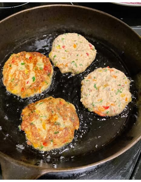 crispy southern salmon croquettes cooking in oil