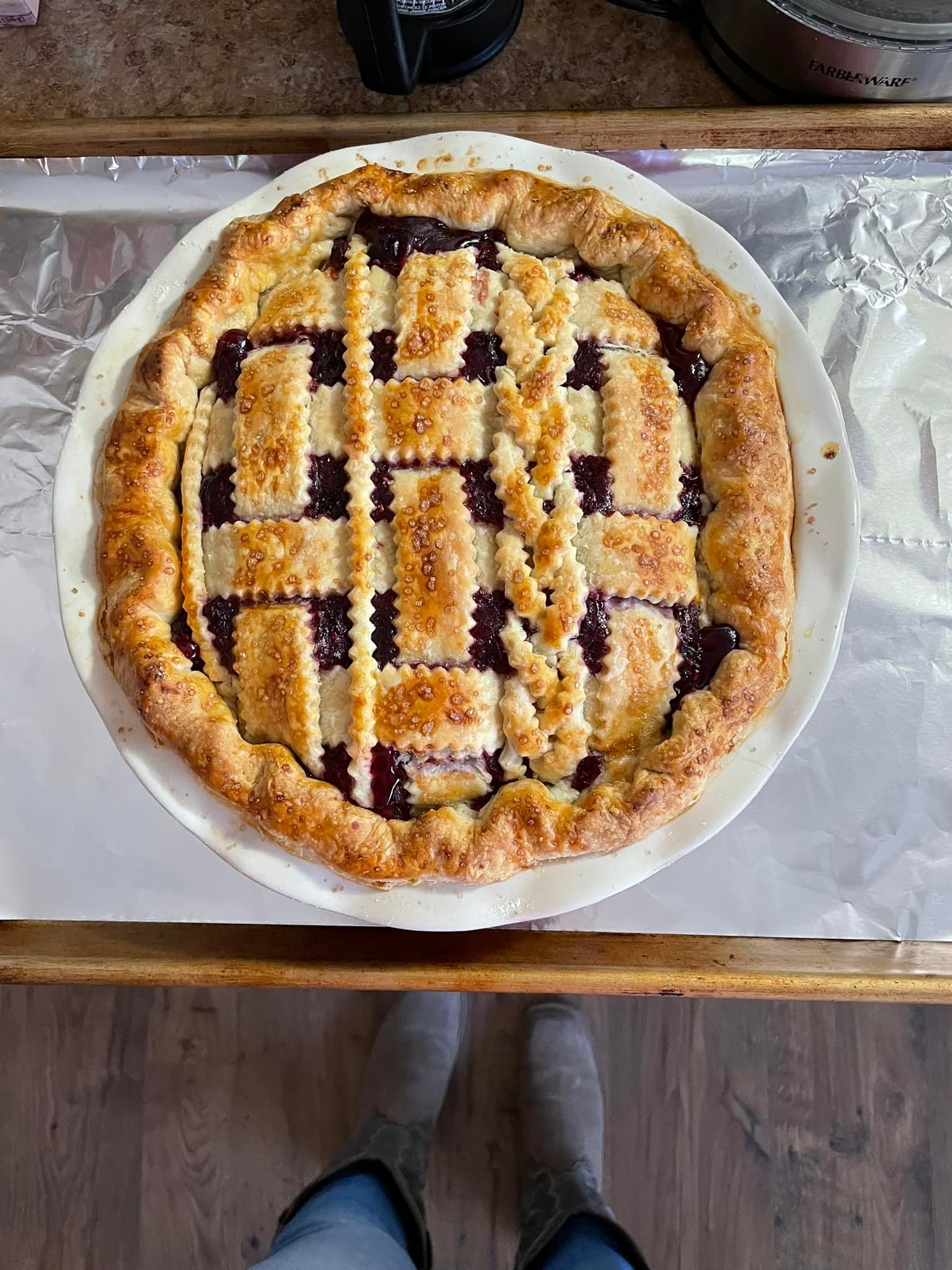 Lattice-topped four berry pie with bubbling berry filling