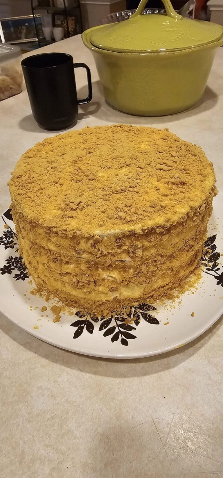 Homemade Medovik honey cake covered in golden honey cake crumbs