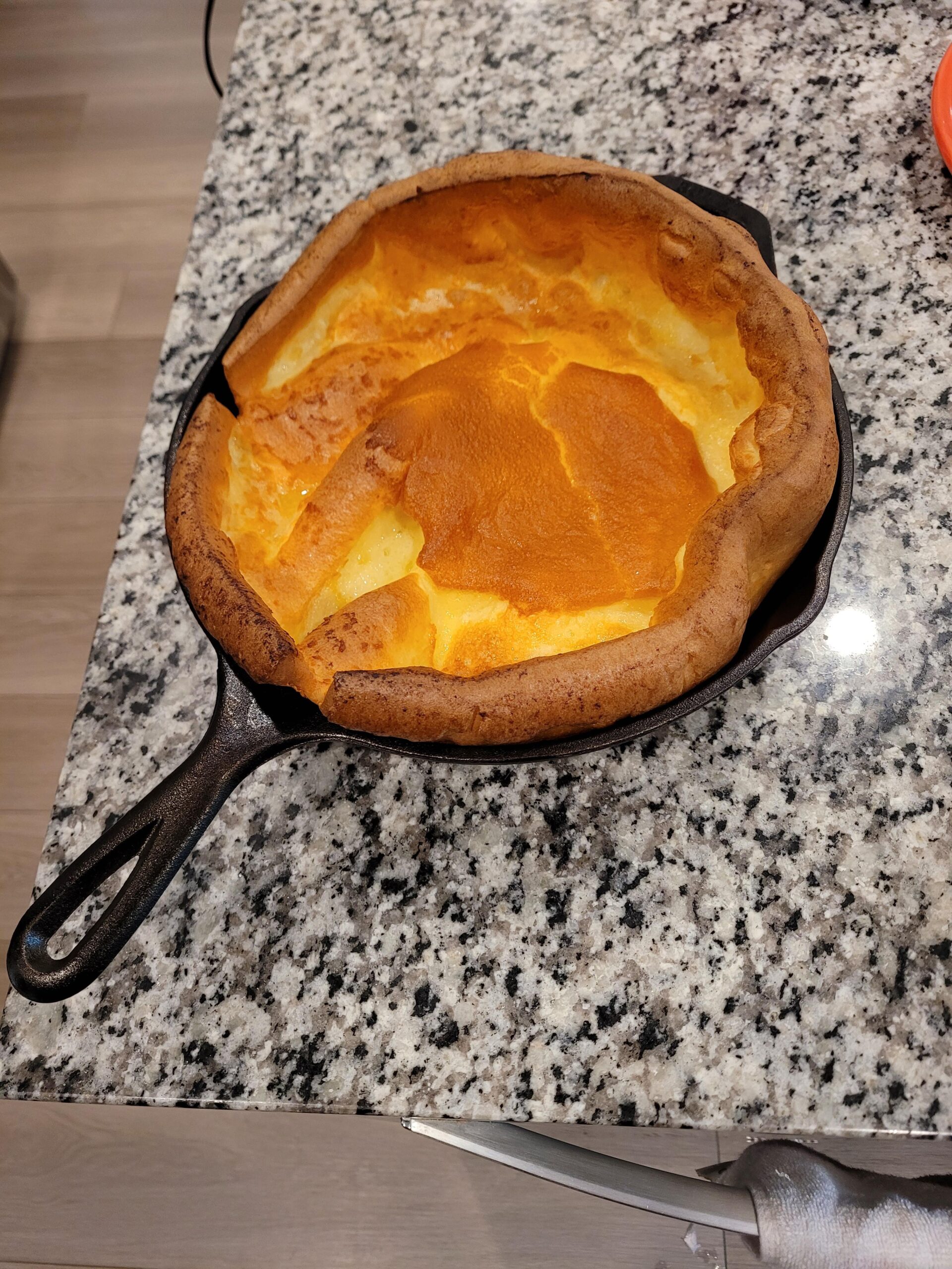 SEO Title: Best Easy Cast Iron Dutch Baby Pancake (Foolproof Recipe) Meta Title: Easy Cast Iron Dutch Baby Pancake | Quick & Fluffy Recipe Meta Description: Learn how to make the perfect cast iron Dutch baby pancake with just a few simple pantry staples. Fluffy, buttery, and ready in under 30 minutes! URL Slug: easy-cast-iron-dutch-baby-pancake Focus Keyword: cast iron Dutch baby pancake Suggested Category: Breakfast & Brunch # Best Easy Cast Iron Dutch Baby Pancake 📍 PLACE IMAGE HERE (o2zlccszu4je1.jpg) Alt Text: A perfectly puffed, golden-brown Dutch baby pancake in a cast iron skillet resting on a granite countertop. ## A Spectacular Weekend Breakfast Classic A Dutch baby pancake is a truly magical breakfast experience. Often called a German pancake or a Bismarck, it is essentially a giant, puffy popover cooked in a sizzling hot cast iron skillet. As it bakes, the edges climb high up the sides of the pan, turning deeply golden and crispy, while the center remains rich, tender, and slightly custardy. Whether you are hosting a special holiday brunch or just treating yourself on a lazy Sunday morning, this dramatic dish always steals the show. The absolute best part about this recipe is how shockingly simple it is to prepare. If you are tired of standing over a hot stove flipping endless batches of individual flapjacks, this one-pan wonder is the perfect solution. The batter comes together in seconds using basic pantry staples you already have in your kitchen. Baking it in a cast iron skillet is the secret to achieving that coveted, crispy crust. The heavy metal holds onto the heat perfectly, ensuring the butter browns beautifully and the batter puffs up to incredible heights. Once you pull this towering, golden masterpiece out of the oven, it will instantly become a permanent fixture in your morning rotation. ## Why You'll Love This Recipe * **Hands-Off Cooking:** Forget flipping pancakes! Simply pour the batter into the hot skillet, pop it in the oven, and let the heat do all the hard work. * **Incredible Presentation:** The dramatic, bowl-like puff of the pastry looks incredibly impressive and gourmet right out of the oven. * **Simple Ingredients:** You only need eggs, flour, milk, sugar, and butter. There are no complicated or expensive ingredients required. * **Highly Customizable:** The subtly sweet, buttery base pairs perfectly with a massive variety of fresh fruits, syrups, and powdered sugar. * **Foolproof Method:** The unique two-step baking temperature ensures the pancake rises beautifully without burning the delicate edges. ## Ingredients * **Eggs:** 3 large eggs. It is absolutely crucial that these are at room temperature to achieve the maximum lift and puff. * **All-Purpose Flour:** 1/2 cup of standard all-purpose flour, spooned and leveled. * **Milk:** 1/2 cup of whole milk or 2% milk. Like the eggs, the milk must be at room temperature so the batter does not seize. * **Sugar:** A generous pinch of granulated sugar to encourage browning and add a hint of sweetness. * **Butter:** 2 tablespoons of unsalted butter to coat the skillet and create a rich, savory crust. ## Step-by-Step Instructions ### Step 1: Prep Your Ingredients Before you begin, make sure your eggs and milk are sitting at room temperature. Cold ingredients will weigh down the batter and prevent the Dutch baby from puffing up properly in the oven. Preheat your oven to 425°F (220°C). ### Step 2: Blend the Batter In a medium mixing bowl, vigorously whisk the room-temperature eggs, milk, all-purpose flour, and a pinch of sugar together. You want the batter to be completely smooth and free of any flour lumps. For the best results, you can also pulse these ingredients together in a blender for about 30 seconds. ### Step 3: Melt the Butter Place a 10-inch cast iron skillet directly into the preheating oven for a few minutes until it is scorching hot. Carefully remove the hot skillet using an oven mitt, drop in the 2 tablespoons of butter, and swirl it around until it is completely melted and bubbling. ### Step 4: The High-Heat Bake Immediately pour your smooth batter directly into the center of the hot, buttered skillet. Transfer the pan back into the oven. Bake at 425°F (220°C) for 20 minutes. During this time, the edges will climb up the sides of the skillet and turn golden brown. Do not open the oven door during this phase, or the sudden drop in temperature could cause the pancake to deflate! ### Step 5: The Low-Heat Finish After 20 minutes, lower the oven temperature to 300°F (150°C). Leave the Dutch baby in the oven for an additional 5 minutes. This brilliant temperature drop allows the thick, custardy center of the pancake to finish cooking and drying out slightly without burning those beautiful, crispy edges. Remove from the oven and serve immediately! ## Expert Cooking Tips * **Room Temperature is Mandatory:** Cold milk and eggs will chill the batter, preventing the rapid steam creation needed to make the pancake rise. Set them on the counter for 30 minutes before mixing. * **Preheat the Skillet:** Pouring the batter into a preheated, sizzling hot cast iron pan creates an immediate seal on the dough, encouraging it to climb the walls of the skillet rather than sticking to the bottom. * **Use a Blender:** While you can easily use a whisk, throwing the ingredients into a blender introduces extra air into the batter, which translates to a much taller, fluffier final product. * **Serve Immediately:** Dutch babies begin to deflate almost as soon as they leave the hot oven. Have your toppings prepped and ready so you can slice and serve it right away. ## Variations to Try * **Classic Lemon and Sugar:** Skip the heavy syrups and simply serve the pancake with a generous squeeze of fresh lemon juice and a heavy dusting of powdered sugar. * **Fresh Berry Compote:** Top the warm, buttery center with a spoonful of warm blueberry or strawberry compote and a dollop of fresh whipped cream. * **Savory Herb and Cheese:** Omit the pinch of sugar from the batter. Top the finished pancake with a fried egg, crispy bacon, and a sprinkle of sharp cheddar and fresh chives. ## What to Serve With Cast Iron Dutch Baby Pancake Because this dish is quite rich and buttery, it pairs beautifully with bright, acidic side dishes. Serve it alongside a large bowl of mixed fresh fruit or a crisp citrus salad. If you are serving a crowd, balance the sweet, doughy pastry with savory breakfast staples. A side of thick-cut, crispy bacon, smoky breakfast sausages, or crispy hash browns rounds out the meal perfectly. Do not forget a large pot of hot, freshly brewed coffee! ## Storage & Reheating ### Refrigerator Allow any leftover pancake to cool completely to room temperature. Slice it into wedges and store it in an airtight container in the refrigerator for up to 3 days. ### Freezer While you can technically freeze a cooked Dutch baby for up to 2 months, it is not highly recommended. The delicate, airy texture will become dense and slightly rubbery when thawed. ### Reheating To bring life back to your leftovers, place the wedges on a baking sheet and warm them in a 350°F (175°C) oven for about 5 to 7 minutes until the edges crisp up again. Microwaving will make the pastry soft and soggy. ## Frequently Asked Questions ### Why didn't my Dutch baby puff up? The most common culprit for a flat Dutch baby is using cold ingredients. If your eggs and milk were straight from the fridge, the batter cannot create the rapid steam necessary for lifting. An oven that wasn't fully preheated can also cause a flat bake. ### Can I make the batter ahead of time? Yes! You can blend the batter the night before and store it in the refrigerator. However, you must let the batter sit on the counter for at least 30 minutes to come up to room temperature before pouring it into your hot skillet. ### Do I have to use a cast iron skillet? While cast iron is ideal because of its superior heat retention, you can also use a heavy-bottomed, oven-safe stainless steel skillet or even a 9x13 glass baking dish. Avoid non-stick pans, as they cannot safely handle the high 425°F oven heat. ### What is the difference between a Dutch baby and a regular pancake? Regular pancakes use chemical leaveners (like baking powder or baking soda) and are cooked individually on a stovetop griddle. A Dutch baby uses no leavening agents; it relies entirely on the steam generated from the hot oven to puff up inside a single large pan. ### Can I double this recipe? If you want to double the recipe, you must use a significantly larger pan (like a 12-inch or 14-inch skillet) or bake two separate 10-inch skillets at the same time. If you pour a doubled batter into a 10-inch pan, it will be too heavy to puff up and the center will remain raw. ## Final Thoughts Making a cast iron Dutch baby pancake is one of the easiest ways to bring a touch of bakery-level magic to your home kitchen. With its incredibly crispy edges, custardy center, and stunning presentation, it is a foolproof recipe that delivers maximum impact with minimal effort. Grab your trusty skillet, blend up that batter, and get ready for a phenomenal breakfast! --- Recipe Name: Best Easy Cast Iron Dutch Baby Pancake Description: A wildly impressive, puffy, and golden-brown oven-baked pancake made in a cast iron skillet. Perfect for a quick and elegant breakfast. Prep Time: 5 minutes Cook Time: 25 minutes Total Time: 30 minutes Servings: 2 Yield: 1 (10-inch) pancake Course: Breakfast, Brunch Cuisine: American, German Difficulty: Easy Estimated Calories: 210 kcal Equipment: * 10-inch cast iron skillet * Mixing bowl and whisk (or a blender) * Measuring cups and spoons Ingredients: * 3 large eggs (room temperature) * 1/2 cup all-purpose flour * 1/2 cup milk (room temperature) * 1 pinch granulated sugar * 2 tbsp unsalted butter Instructions: 1. Preheat your oven to 425°F (220°C). 2. In a medium bowl or a blender, thoroughly mix the room-temperature eggs, milk, flour, and a pinch of sugar until the batter is completely smooth and lump-free. 3. Place a 10-inch cast iron skillet in the preheated oven for 3-5 minutes until very hot. 4. Carefully remove the skillet from the oven using an oven mitt. Add the butter and swirl the pan until it is completely melted and bubbling. 5. Immediately pour the blended batter into the center of the hot skillet. 6. Return the skillet to the oven and bake at 425°F (220°C) for exactly 20 minutes. Do not open the oven door! 7. Lower the oven temperature to 300°F (150°C) and bake for a final 5 minutes to allow the center to set and the edges to crisp. 8. Remove from the oven, slice into wedges, and serve immediately with your favorite toppings. Notes: * **Temperature Matters:** Do not skip bringing the milk and eggs to room temperature. It is the secret to a sky-high puff. * **Toppings:** Serve traditionally with powdered sugar and a squeeze of fresh lemon juice, or load it up with maple syrup and fresh berries. Nutrition: Calories: 210kcal | Carbohydrates: 15g | Protein: 7g | Fat: 13g | Saturated Fat: 7g | Cholesterol: 145mg | Sodium: 75mg | Potassium: 120mg | Fiber: 0g | Sugar: 2g | Vitamin A: 450IU | Calcium: 55mg | Iron: 1mg --- * Authentic Danish Aebleskiver (Pancake Balls) * Easy Homemade Cast Iron Drop Biscuits * Classic Cast Iron Skillet Apple Crisps * Best Cast Iron Breakfast Potato Hash
