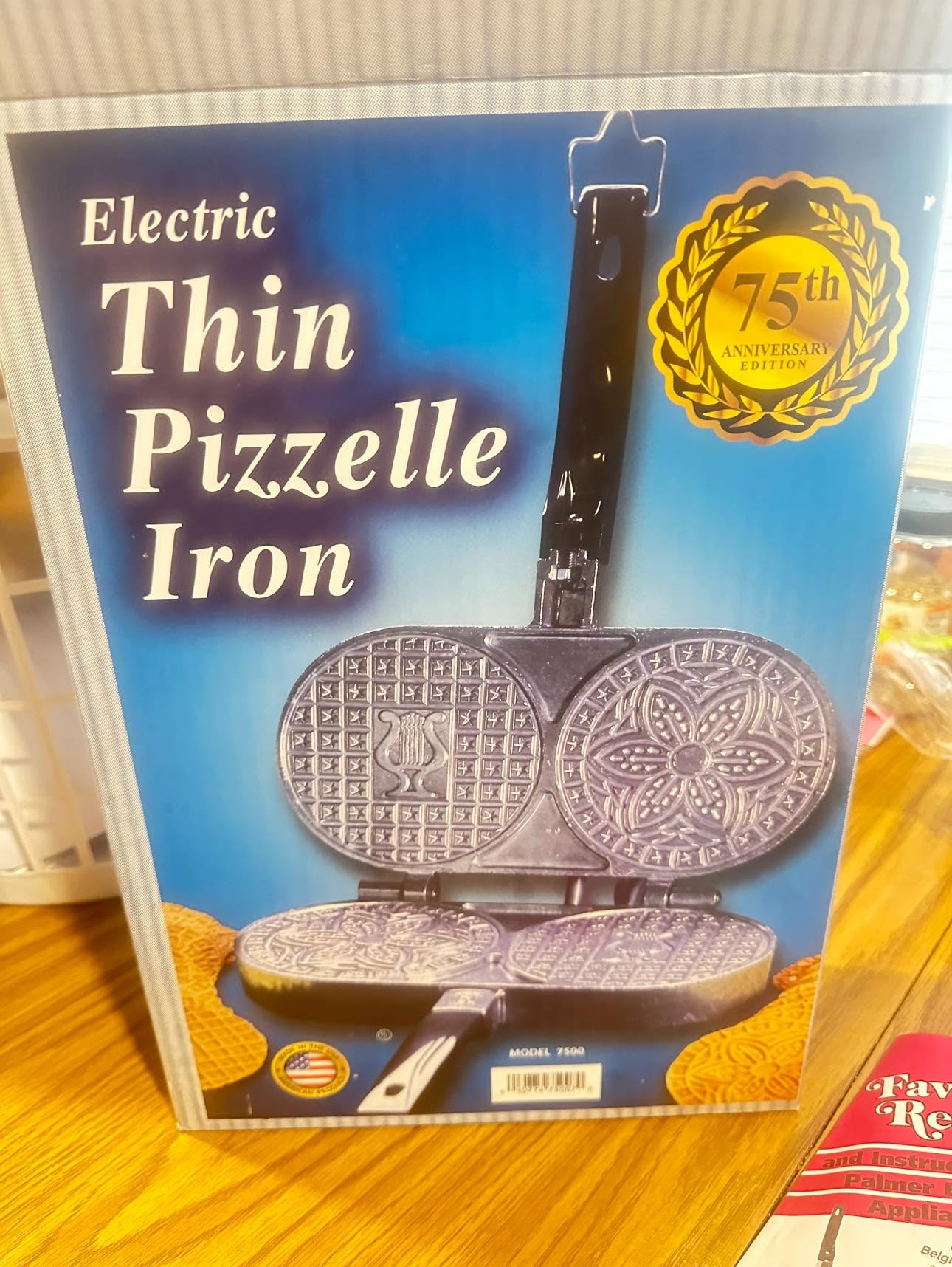 Electric thin pizzelle iron with traditional decorative patterns for making Italian waffle cookies.