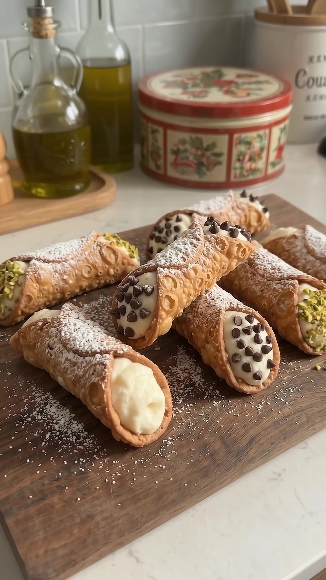 Homemade classic Sicilian cannoli filled with creamy ricotta and decorated with chocolate chips and pistachios.