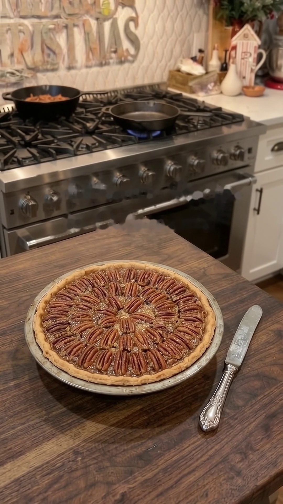 Homemade classic Southern pecan pie with golden flaky crust and pecan halves arranged on top.