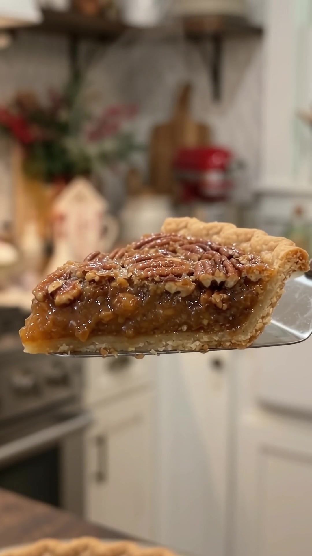 Close-up of a gooey Southern pecan pie slice with rich caramel filling, crunchy pecans, and flaky pastry crust.