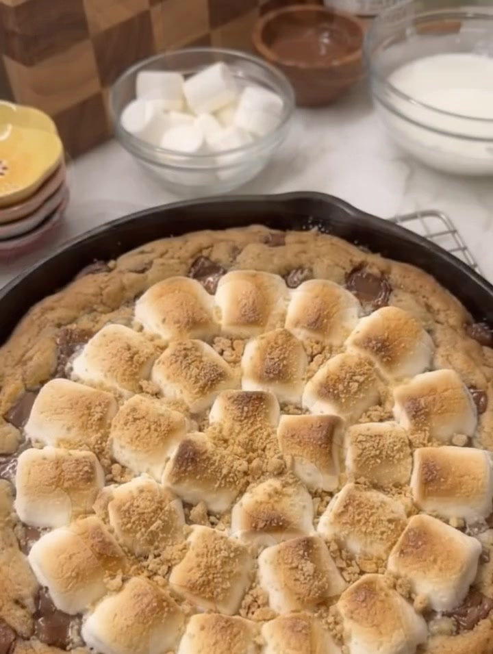 Homemade S’mores Cookie Skillet with golden toasted marshmallows and melted chocolate